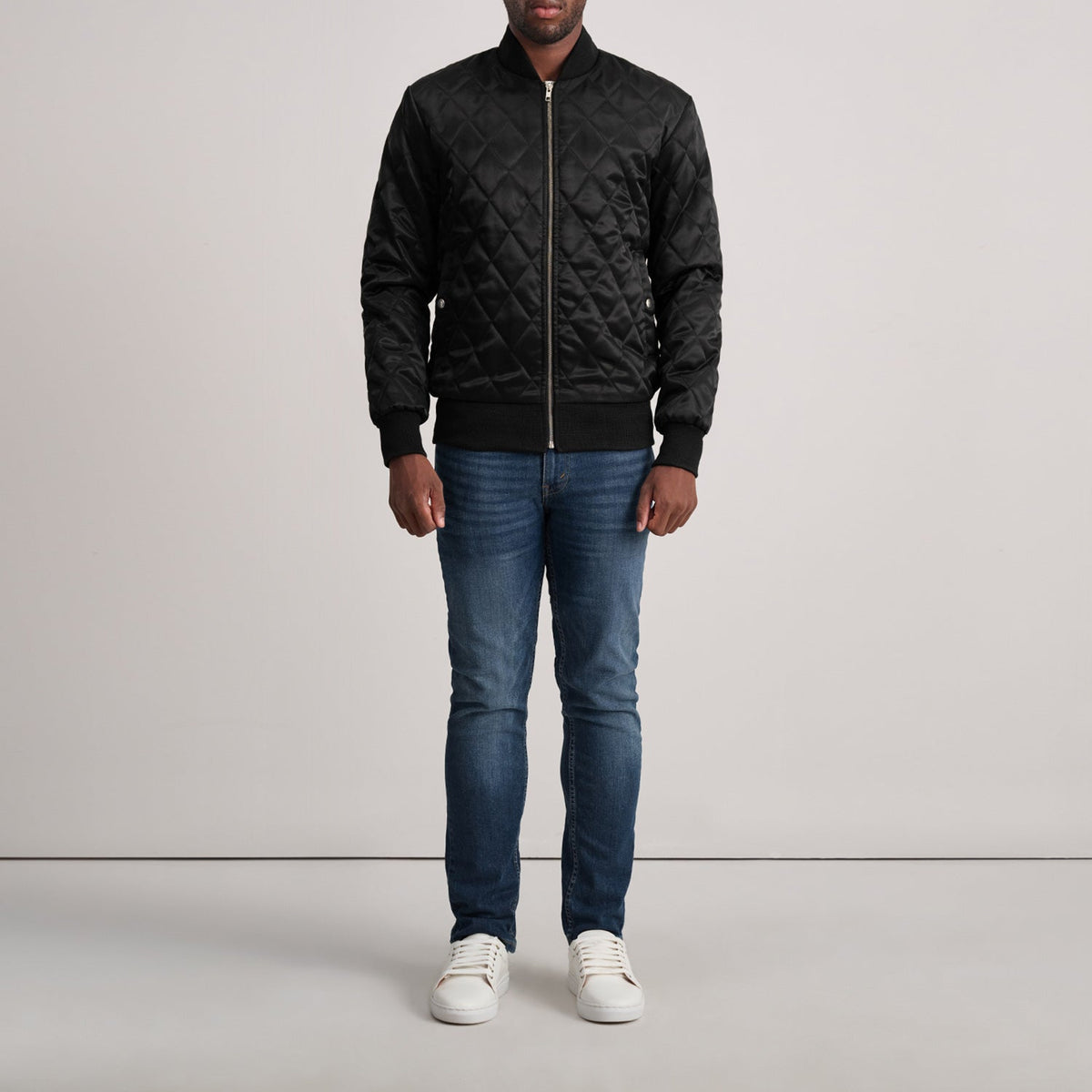 
Close-Up Detail of Varsity & Zipper Hardware on Danson Quilted Black Varsity Jacket