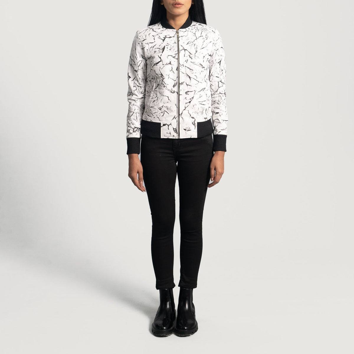 
Close-Up Detail of Varsity & Zipper Hardware on Women's Donna Blake White Leather Bomber Jacket
