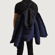 Close-Up Detail of Classic Collar &amp; Zipper With Wind Flap Hardware on Erico Blue Hooded Puffer Jacket