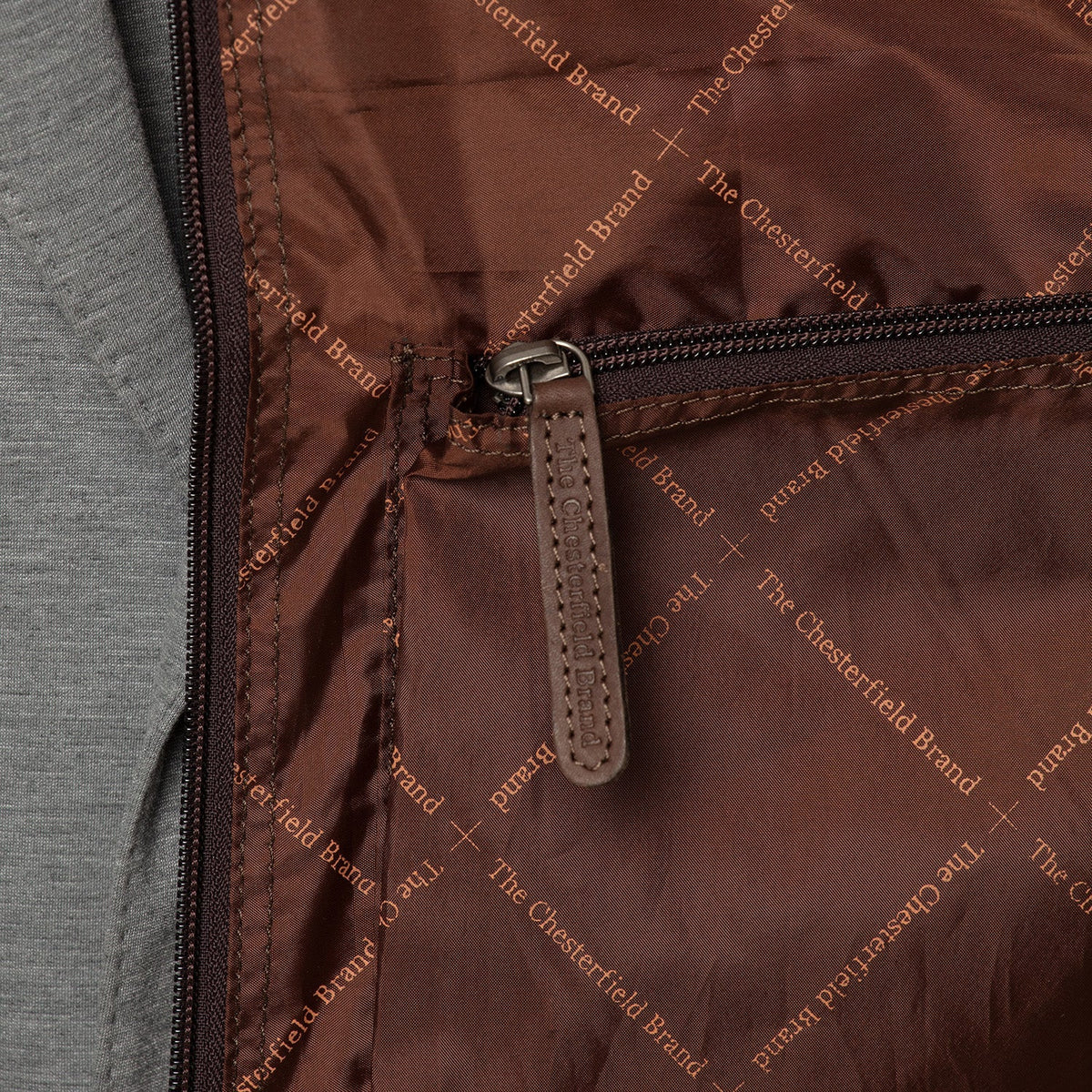 
Styled Fit Perspective of Leather Garment Bag Josh on Model - Natural Daylight Drape